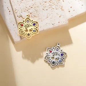 Close-up showing stainless steel Tree of Life lotus pendants with colorful zircon stones