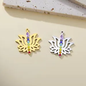 Detail view of gold and silver chakra lotus flower pendants set with colorful stones