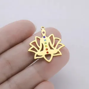 Detailed close-up of a gold stainless steel yoga lotus pendant with chakra stones