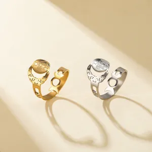 Detailed macro view of gold and silver Triple Moon Goddess rings with crescent moons
