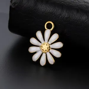 Detail view of a white enamel daisy pendant with gold-tone center on black leather