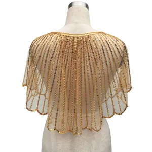 Detailed view of a luxury vintage gold sequined shawl for formal evening party dresses