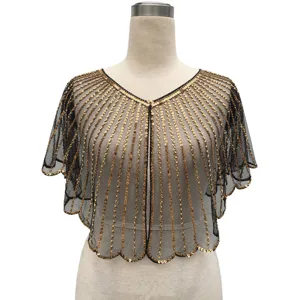 Close-up of gold sequin lines on black mesh vintage party capelet