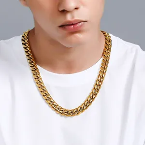 Detail shot of a men's 18K gold plated stainless steel Cuban link necklace on model