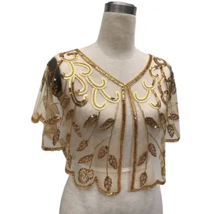 Detailed shot of vintage gold sequin bolero shawl with elegant beadwork and mesh fabric