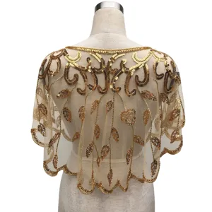Rear view detail of a gold sequined mesh shawl on a mannequin for party dresses