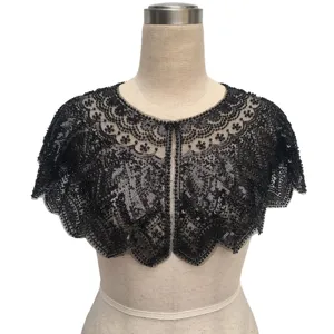 Detailed shot of a vintage black sequined and beaded capelet on a dress form.