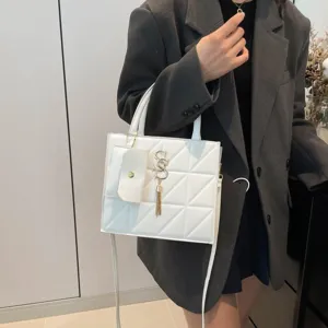 White quilted square crossbody bag with gold tassel and mini pouch detail