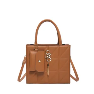 Elegant brown quilted square crossbody handbag with metallic tassel logo and mini pouch