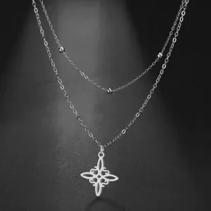 Close-up of a stainless steel double-layer necklace with a Celtic witch's knot pendant.