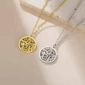 Detailed view of gold and silver stainless steel pentagram necklaces with esoteric engravings.