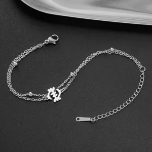 Detail shot of stainless steel double chain bracelet with Africa Gye Nyame symbol charm