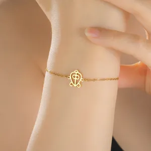 Gold stainless steel adjustable bracelet featuring a delicate African Adinkra symbol pendant