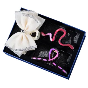 Gift set of elegant hair claw clips featuring a chic white bow and wavy fashion designs.