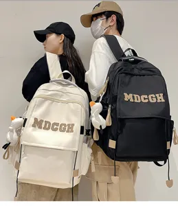 Sacs à dos grande capacité noir et blanc style couple avec logo MDCGH imprimé sur le rabat