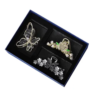 Luxury hair claw clip gift set featuring elegant rhinestone butterfly and floral designs for women.
