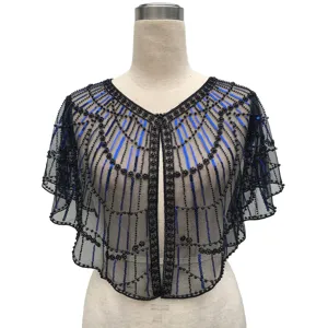 Detailed view of vintage black mesh shawl with blue sequins and beaded patterns