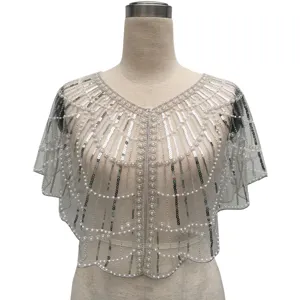 Detailed view of a vintage sheer mesh capelet with intricate silver sequin and pearl beadwork.