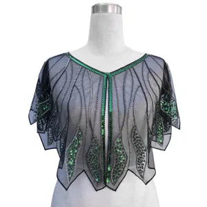 Detail of vintage 1920s black mesh capelet with green sequins and silver beads