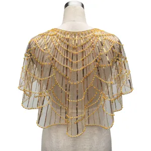 Detailed back view of vintage gold sequin and beaded evening cape with scalloped edges