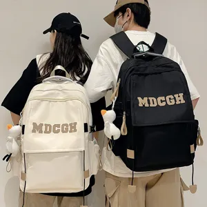 Sac à Dos Scolaire en Nylon Grande Capacité Protection de la Colonne Vertébrale Unisexe Tendance Street Décontracté Avec Pendentif