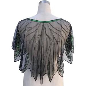 Rear view detail of 1920s vintage black sequined shawl with green beadwork