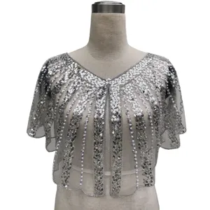 Close-up detailed view of silver sequined capelet with pearl beads on evening shrug