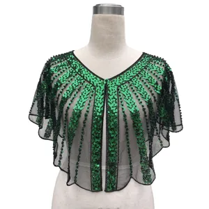 Detailed close-up of a vintage style green sequined evening shawl with elegant black mesh