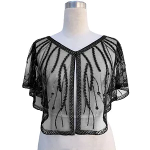 Close-up of a black 1920s sequined and beaded mesh capelet on a white mannequin