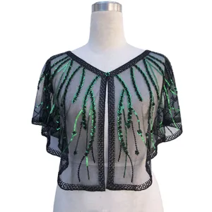 Close-up of a 1920s retro black mesh shawl with green sequin embroidery on a mannequin