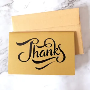 Retro gold bronzing Thanks greeting card with kraft paper envelope on marble background
