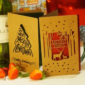 Vintage kraft paper Christmas cards featuring laser-cut deer and festive snowflake designs