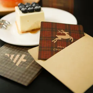 Set of plaid Christmas greeting cards featuring reindeer design and kraft paper envelopes