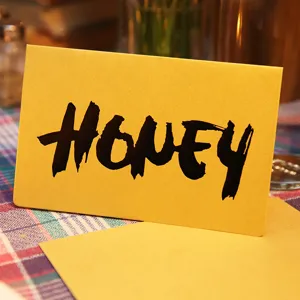 Yellow vintage greeting card with 'HONEY' brush script lettering and matching envelope