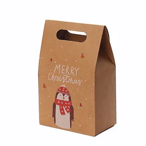 Kraftpapier kerstcadeauzakje met pinguïnmotief en de tekst Merry Christmas voor feesten