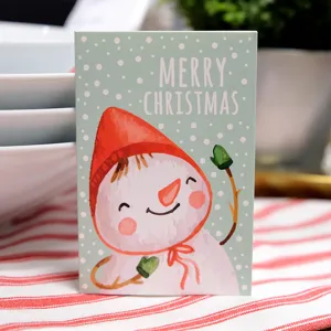 Mini folding Christmas greeting card featuring a cute snowman illustration and Merry Christmas text