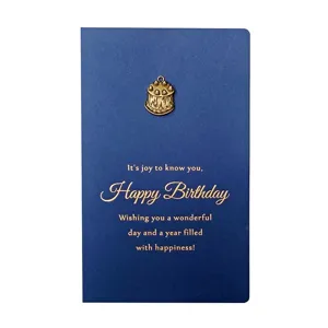 Retro dark blue birthday greeting card with gold foil text and vintage metal cake charm