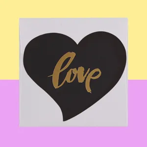 Minimalist white greeting card with black heart and gold foil Love script design