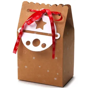 Festive brown kraft paper gift box with red snowflake ribbon and bell tag decoration
