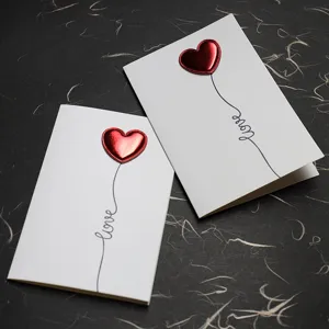 Minimalist 3D Valentine's greeting cards with red leather hearts and love script