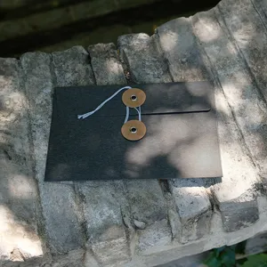 Retro special paper envelope with creative string-and-washer closure for postcards