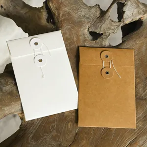Retro minimalist kraft paper and white envelopes with string-and-button closure