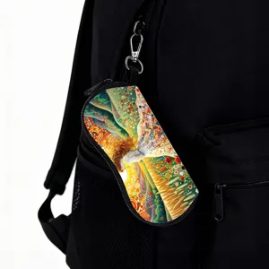Artistic mosaic print glasses pouch with hook hanging on a black backpack for travel