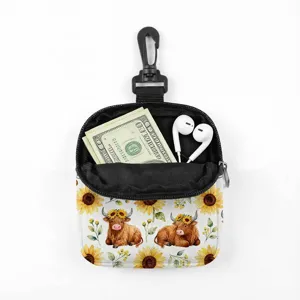 Detail of portable coin pouch with highland cow and sunflower pattern showing storage
