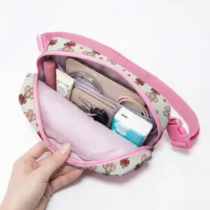 Interior view of the tulip print waist bag showing organized storage capacity