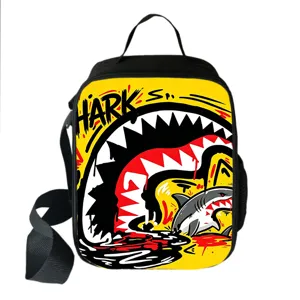 Detail view of the vivid shark graffiti print on the square insulated lunch bag