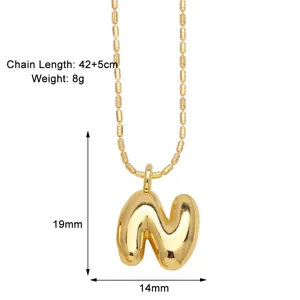 Detail shot of gold-plated puffy letter N pendant necklace with bead chain, size 19x14mm.