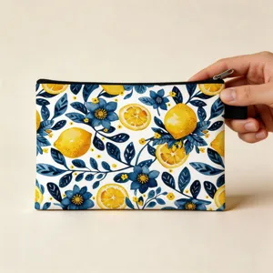 Close-up detail of the lemon and blue floral print cosmetic travel pouch with zipper