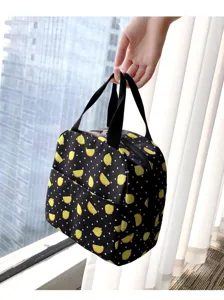 Dettaglio della borsa termica portatile con stampa di limoni gialli su pois neri
