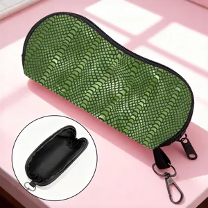 Green animal scale print sunglasses pouch with zipper and black interior detail.